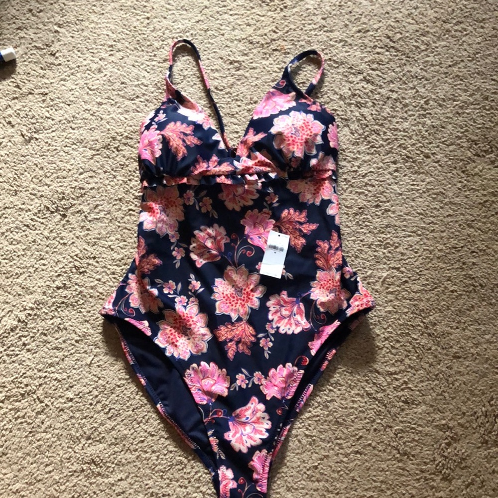 One piece navy and pink floral swimsuit.